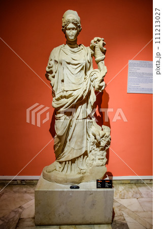 The statue of Hygieia. Marble statues of gods and emperors of antiquity in the Museum of Antiquities of Antalya, Turkey. The statue of Hygieia. Marble statues of gods and emperors of antiquity in the Museum of Antiquities of Antalya, Turkey. 111213027