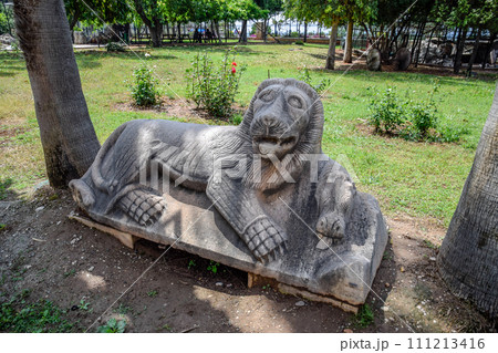 Stone lion carved from a piece of limestone 111213416