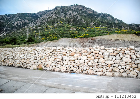 Strengthening of a dump of soil along roadside. 111213452