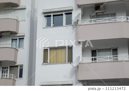Balconies and windows of a multistory building 111213472