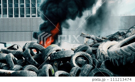 Pile of burning tyres during street riots 111213474