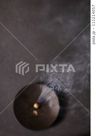 Meditative Glow of Incense Ember with Rising Smoke Patterns 111214057