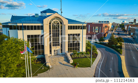 City of Muncie building aerial at sunset with gorgeous blue sky and street through downtown City of Muncie building aerial at sunset with gorgeous blue sky and street through downtown 111214163