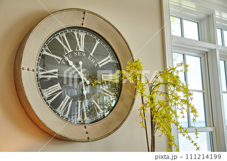 Vintage Clock and Forsythia Blooms in Serene Interior 111214199
