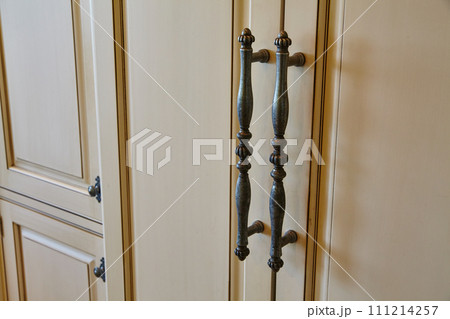 Elegant Antique Door Handles on Cream Double Doors 111214257