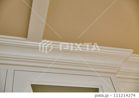 Elegant Crown Molding and Door Frame Detail in Home Interior 111214274