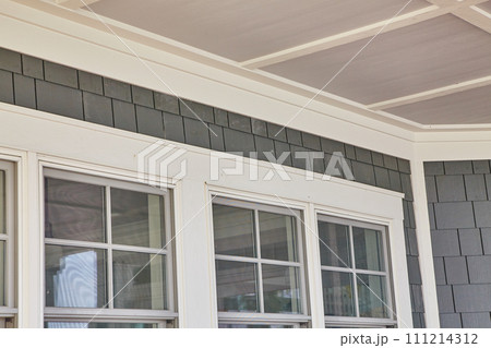 Architectural Detail of Residential Building with Window Trim and Shingle Siding Architectural Detail of Residential Building with Window Trim and Shingle Siding 111214312