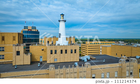 Aerial View of Urban Lighthouse on Art Deco Building Rooftop 111214374