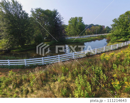 Aerial Serene Lakeside with White Fence and Lush Trees, Auburn Aerial Serene Lakeside with White Fence and Lush Trees, Auburn 111214643