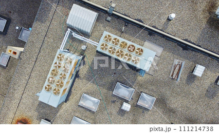 Aerial View of Commercial HVAC Units and Ventilation Equipment on Gravel Rooftop Aerial View of Commercial HVAC Units and Ventilation Equipment on Gravel Rooftop 111214738