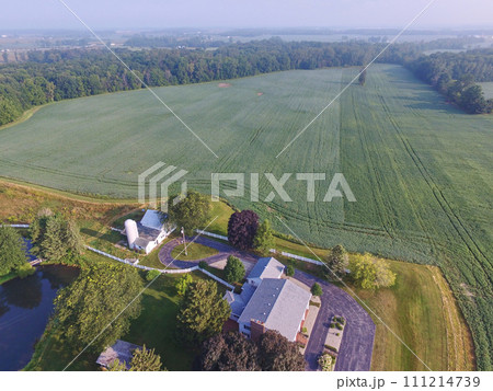 Aerial View of Serene Rural Farmhouse and Fields in Indiana Aerial View of Serene Rural Farmhouse and Fields in Indiana 111214739
