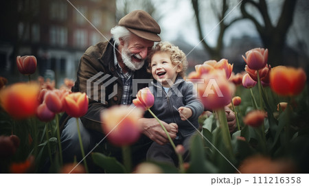 Grandfather and Grandchild amidst tulip fields. Grandfather and his grandchild revel in the joy of nature, surrounded by the vibrant beauty of tulip filled meadows. Generative AI. Grandfather and Grandchild amidst tulip fields. Grandfather and his grandchild revel in the joy of nature, surrounded by the vibrant beauty of tulip filled meadows. Generative AI. 111216358