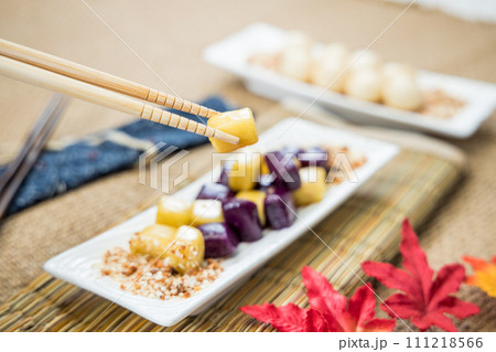 Taiwanese traditional sweet and dessert, glutinous rice dumplings and sweet potato dumplings with coconut sugar and peanuts and coconut flakes 111218566