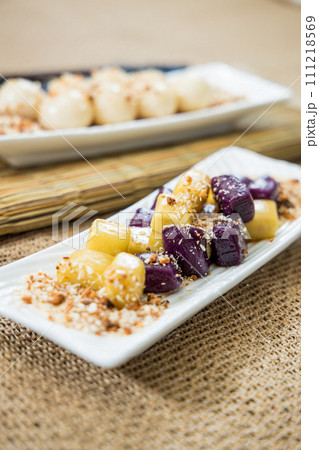 Taiwanese traditional sweet and dessert, glutinous rice dumplings and sweet potato dumplings with coconut sugar and peanuts and coconut flakes 111218569