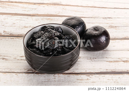 Dry prunes in thw bowl Dry prunes in thw bowl 111224864
