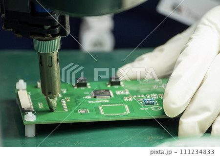 Close up scene the PCB board checking process by operator. Close up scene the PCB board checking process by operator. 111234833