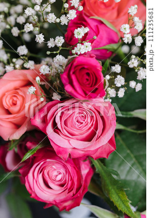 Bouquet of pink roses at home. Vase with flowers on the table Bouquet of pink roses at home. Vase with flowers on the table 111235681