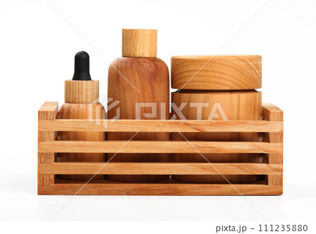 Hygiene toiletries in wooden organizer on white Hygiene toiletries in wooden organizer on white 111235880