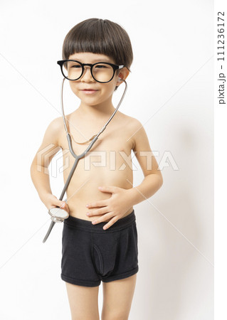 Cute Asian kid playing doctor with stethoscope isolated on white. 111236172