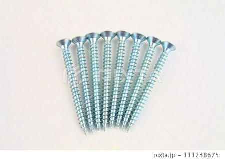 Set of screws for construction on a white background, metal screw, iron screw, chrome screw, screws as a background, wood screw. Close-up Set of screws for construction on a white background, metal screw, iron screw, chrome screw, screws as a background, wood screw. Close-up 111238675