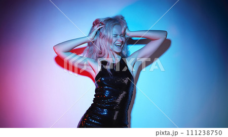 Fashion Woman in Glitter Black Dress Laughing, Dancing at Disco Party Fashion Woman in Glitter Black Dress Laughing, Dancing at Disco Party 111238750