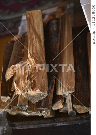 Chopped firewood. Wooden firewood for kindling the stove. Wood fuel. Chopped firewood. Wooden firewood for kindling the stove. Wood fuel. 111239050