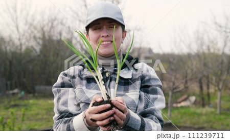 farmer woman holding soil with sprout field hand, business farmer work farm, agriculture concept, holding young fresh green sprouts hands, happy face farmer woman, agriculture concept, gardening 111239711
