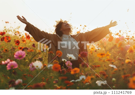 Woman joyfully dancing in a field of flowers Woman joyfully dancing in a field of flowers 111241769