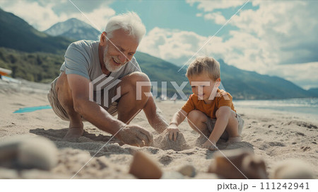 Caucasian grandfather and grandson build sand on the beach. Caucasian grandfather and grandson build sand on the beach. 111242941