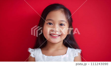 Young Asian girl on red background. Young Asian girl on red background. 111243090