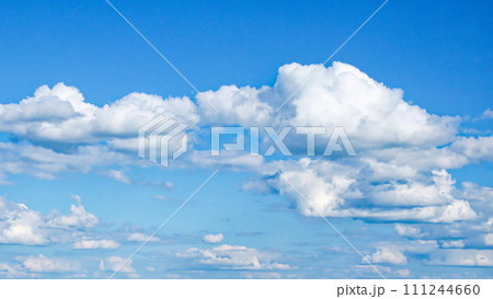 Clouds dotting a bright and clear blue sky. Clouds dotting a bright and clear blue sky. 111244660