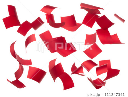 Red ribbon long straight fly in air with curve roll shiny. Red ribbon for present gift birthday party to wrap around decorate and make of textile cloth many small pieces. White background isolated Red ribbon long straight fly in air with curve roll shiny. Red ribbon for present gift birthday party to wrap around decorate and make of textile cloth many small pieces. White background isolated 111247341