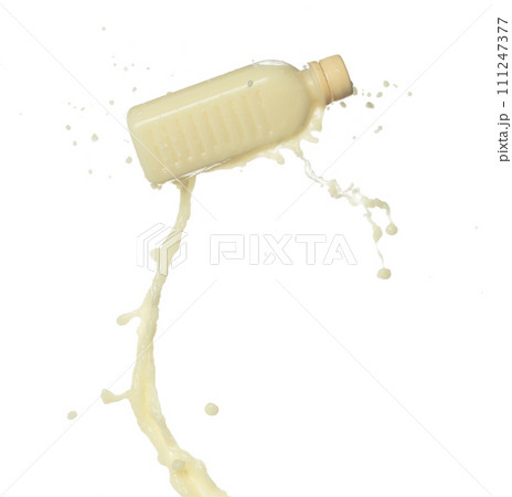 Tofu Soybean soymilk pour fall down in bottle container. Soybean milk or cosmetic cream moisturizer spill splash as paint color. White background isolated high speed shutter freeze motion Tofu Soybean soymilk pour fall down in bottle container. Soybean milk or cosmetic cream moisturizer spill splash as paint color. White background isolated high speed shutter freeze motion 111247377