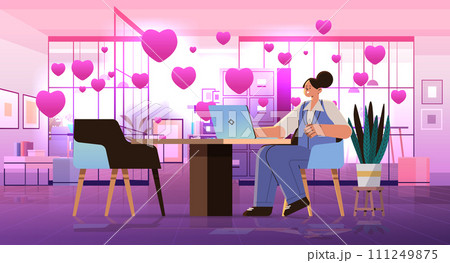 businesswoman in love using laptop social media communication happy valentines day celebration concept office interior with pink hearts 111249875