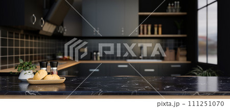 A space for displaying your product on a black marble kitchen countertop in a modern black kitchen. 111251070