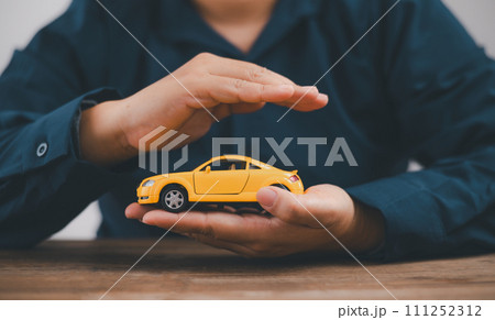 Hand Protecting Car,symbol of Car Insurance and Coverage for Auto Safety , Security,Protection against Accidents and Damages 111252312