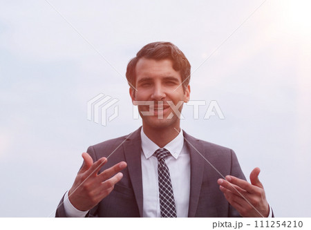 Business caucasian man isolated on white background having doubts while raising hands 111254210