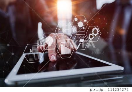 businessman pressing his finger on the screen of the digital tab 111254275