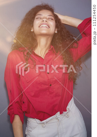Close up view. Beautiful girl sincerely smiling on a gray background 111254450