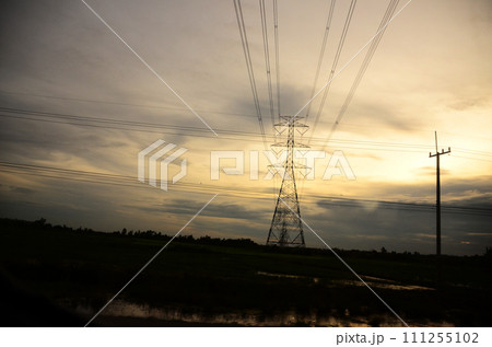 High voltage pole electric wiring distribution landscape energy engineering. Electricity energetic background with blue sky green mountain in countryside. Electric power energy engineering industrial High voltage pole electric wiring distribution landscape energy engineering. Electricity energetic background with blue sky green mountain in countryside. Electric power energy engineering industrial 111255102