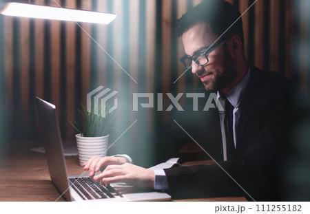 boss of the corporation looks into his laptop boss of the corporation looks into his laptop 111255182