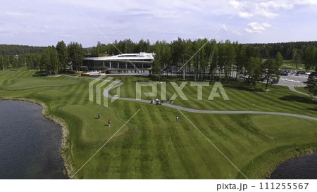 Golf course on a Sunny day, an excellent Golf club with ponds and green grass, view from the sky 111255567