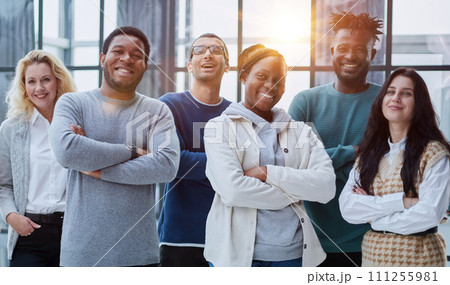 Group of business people standing at the window of a modern office 111255981