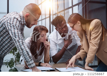 Ambitious smart employee speaks in a meeting and shares her opinion on a creative idea in a group briefing Ambitious smart employee speaks in a meeting and shares her opinion on a creative idea in a group briefing 111256667