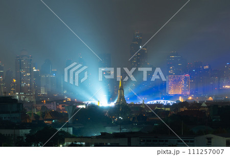 Aerial top view of Temple of Dawn or Wat Arun with urban city town in Rattanakosin Island in architecture, Urban old town city, Bangkok skyline. downtown area, Thailand. 111257007