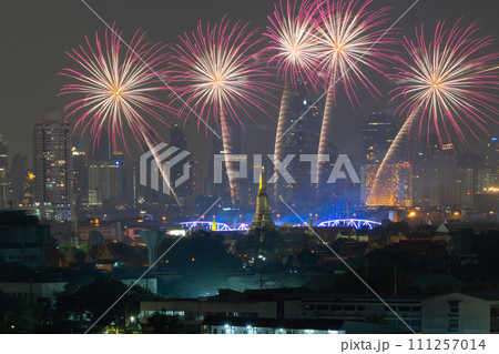 Fireworks of Temple of Dawn or Wat Arun with urban city town in Rattanakosin Island in architecture, Urban old town city, Bangkok skyline. downtown area at night, Thailand. Fireworks of Temple of Dawn or Wat Arun with urban city town in Rattanakosin Island in architecture, Urban old town city, Bangkok skyline. downtown area at night, Thailand. 111257014