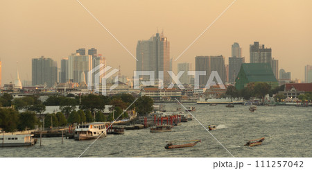 Aerial view of Bangkok Downtown Skyline with Chao Phraya River, Thailand. Financial district and business centers in smart urban city in Asia. Skyscraper and high-rise buildings. Aerial view of Bangkok Downtown Skyline with Chao Phraya River, Thailand. Financial district and business centers in smart urban city in Asia. Skyscraper and high-rise buildings. 111257042