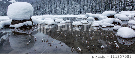 Glacier Lake Covered in Snow in Winter Time. Canadian Nature Landscape Background Glacier Lake Covered in Snow in Winter Time. Canadian Nature Landscape Background 111257683