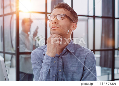 Portrait of a pensive young man face closeup. Thoughtful man in her 20s. Pensive expression 111257889