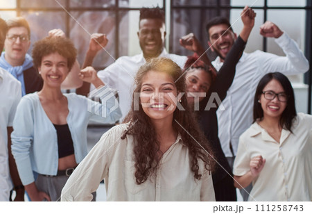 Multiethnic young business people working together in the office Multiethnic young business people working together in the office 111258743